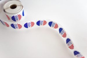 a roll of I Voted stickers - Dan Moisand discusses if the 2020 presidential election will make the market crash