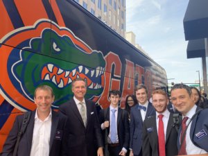 UF students with Charlie in front of Gator bus